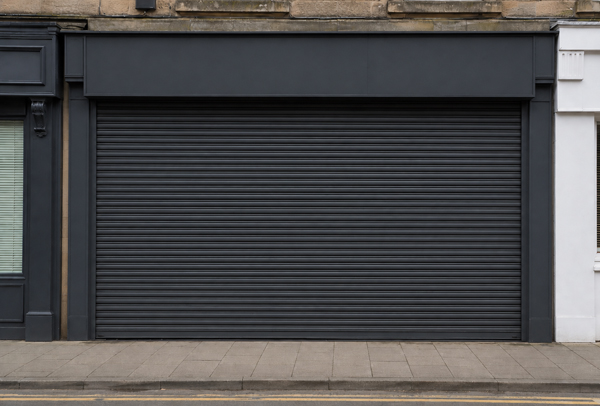 Serviceable roller shutter after commercial refinishing in Rugby