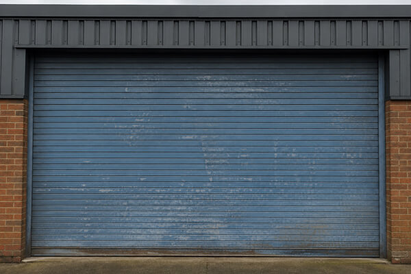Commercial roller shutter door before repainting in Milton Keynes