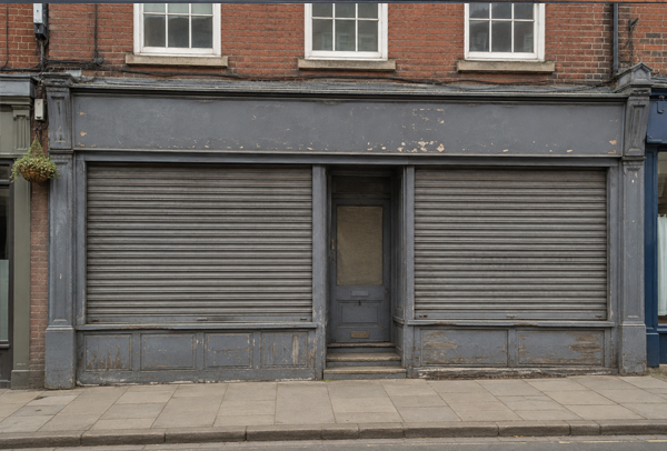 Shop roller shutter before painting in Milton Keynes
