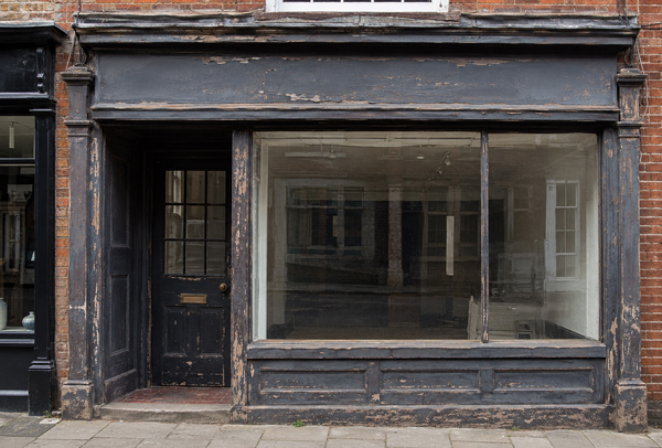 Traditional timber shop front before renovation in Winslow