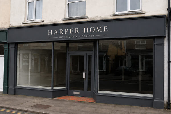 Updated shop frontage after professional spray painting in Leighton Buzzard