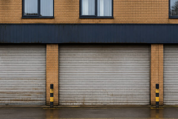 Commercial property shutter door before maintenance painting in Hatfield