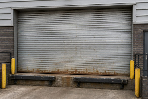 Loading bay shutter door before painting in Hatfield