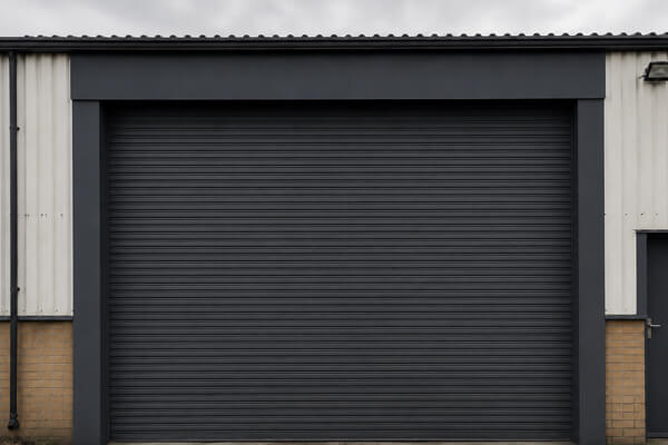 Commercial roller shutter door after professional painting in Hatfield