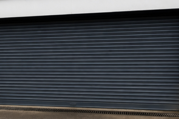 Warehouse roller shutter door after painting in Hatfield