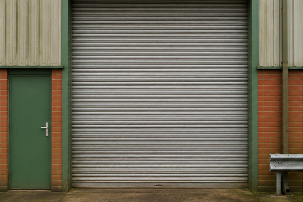 Roller shutter door before matching surrounding cladding in Winslow